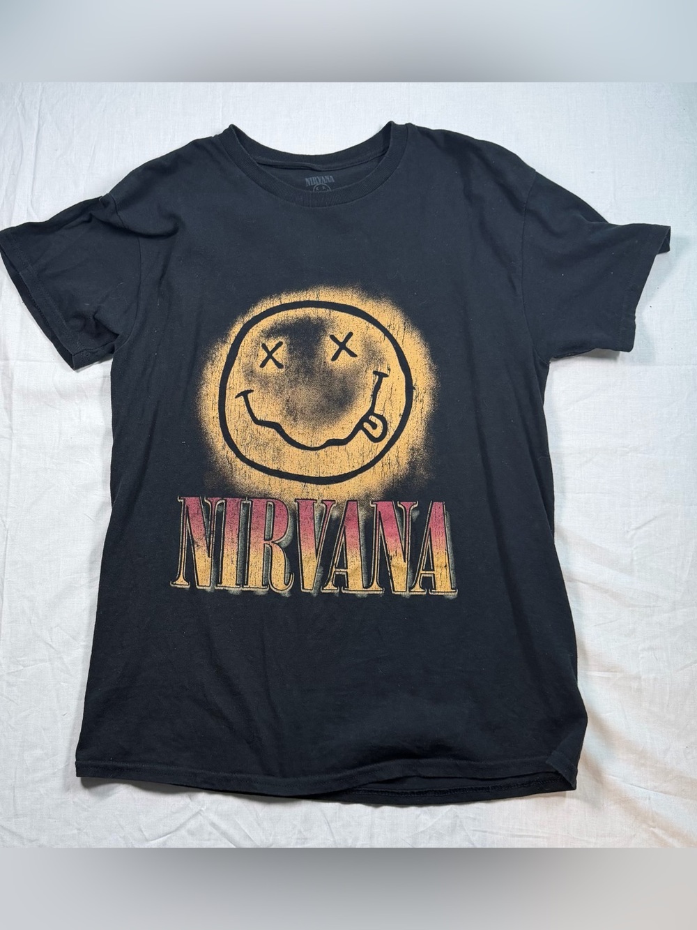 NIRVANA Black Tee with Yellow Smiley and Red-Gold Logo